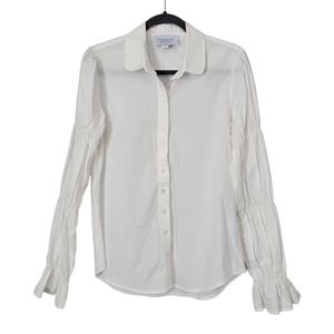 The Shirt by Rochelle Behrens white puffed sleeve ruffled cuff white button down